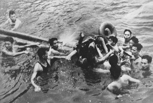 2 - An airman being captured by Vietnamese in Truc Bach Lake, Hanoi in 1967. The airman is John McCain