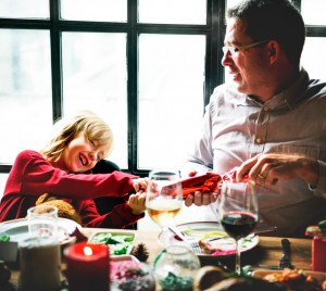Family At Table With A Festive Dinner