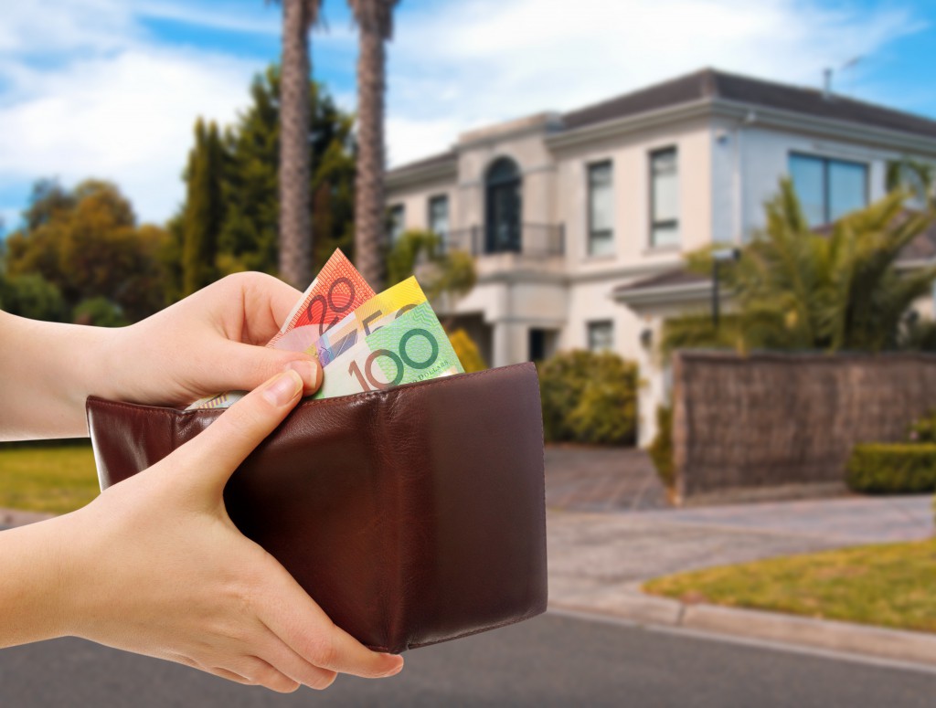Australian Money In Wallet On Real Estate Background