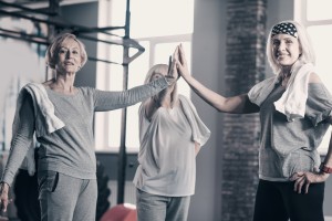 Three Senior Women Giving Each Other A High Five